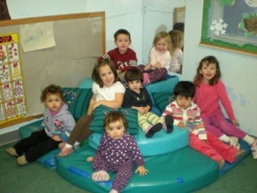 Toddlers to preschoolers inside one of the Small World classrooms.